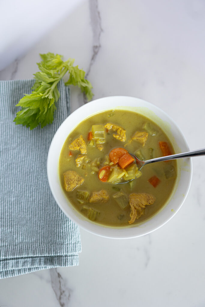 Soup with chicken, carrots, broth, and rice in a bowl