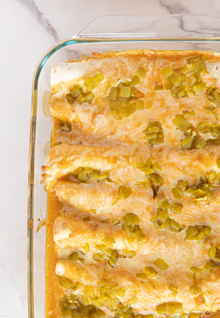 White chicken enchiladas in a glass pan