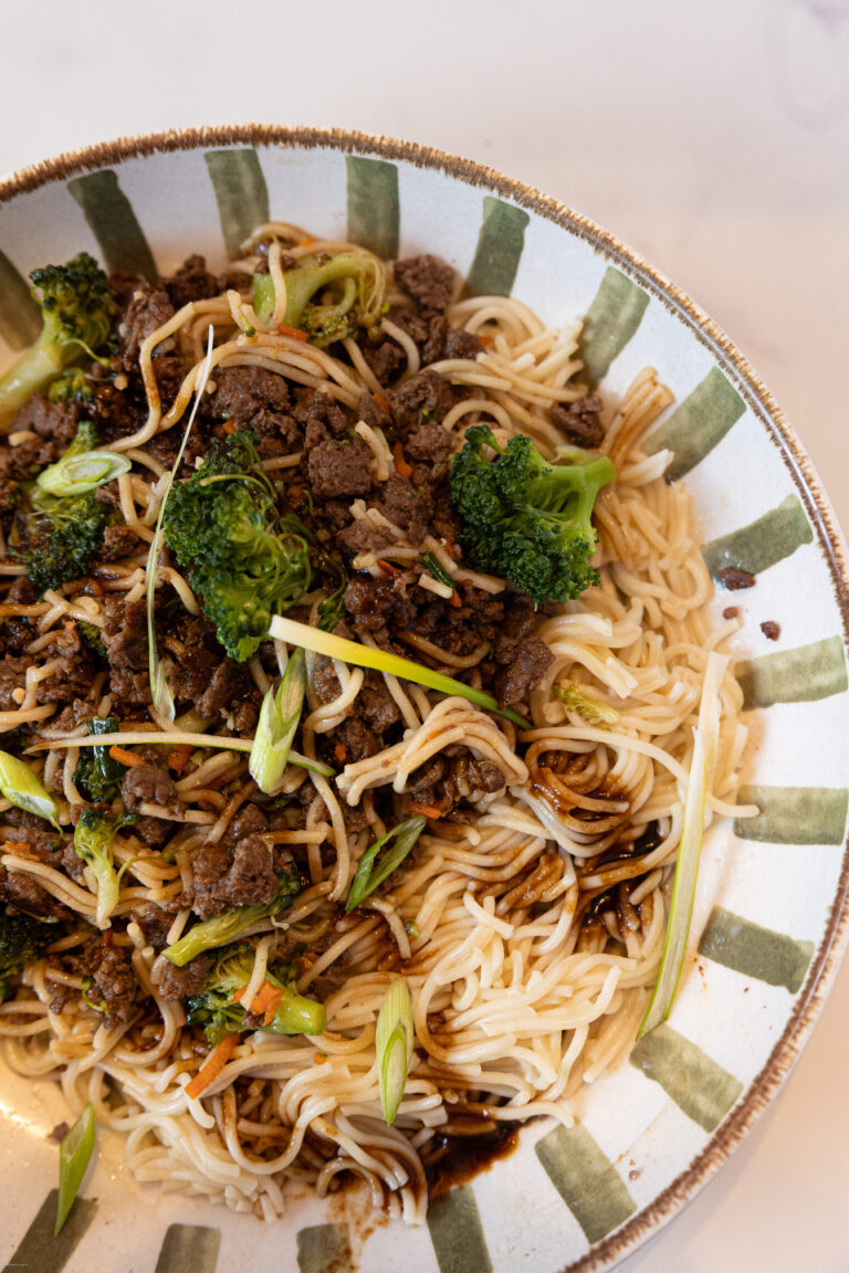 Beef and noodles and broccoli on a plate