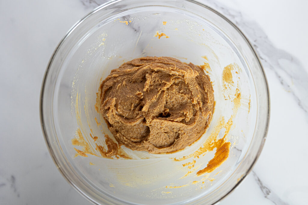 A peanut butter mixture in a glass bowl